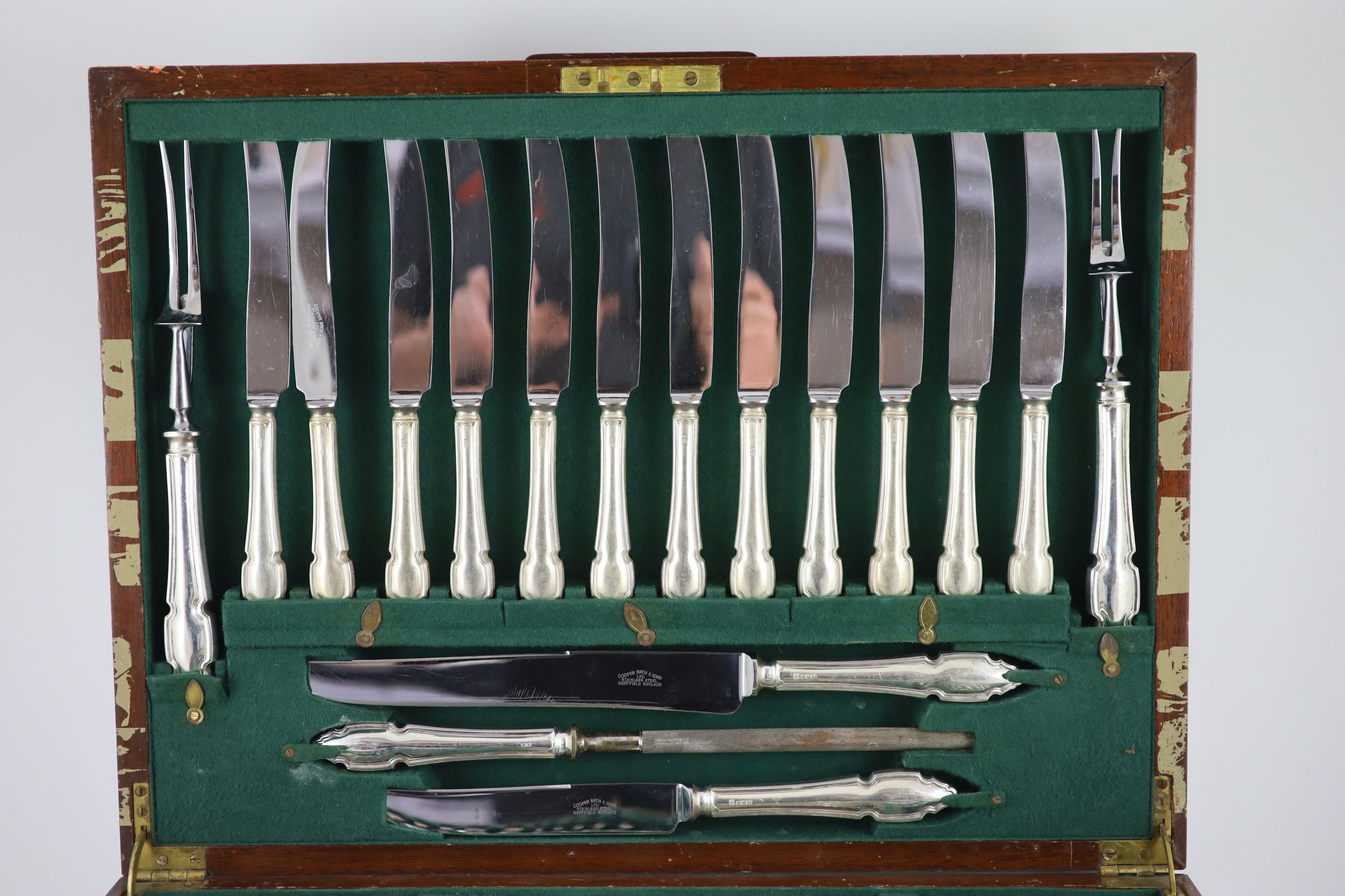 An almost complete canteen of silver Chippendale pattern cutlery for twelve, by Cooper Brothers & Sons